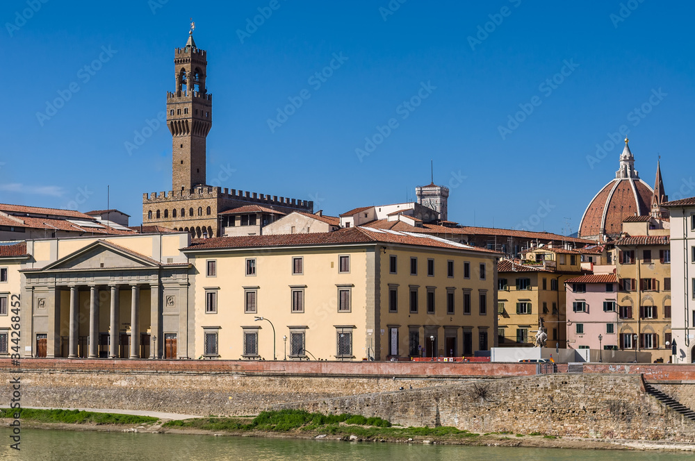 Florence Chamber of Commerce (Camera di Commercio di Firenze) and tower of Old Palace (Palazzo Vecchio). Florence, Tuscany, Italy.
