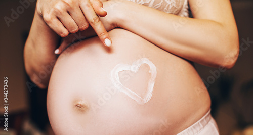 Wallpaper Mural pregnant woman with hands on belly Torontodigital.ca