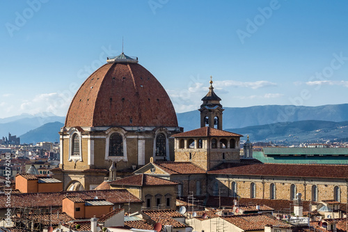 The dome of the Cappella dei Principi dominates the San Lorenzo architectural complex (Medici Chapels). Aerial view from Giotto's Campanile. Florence, Tuscany, Italy.