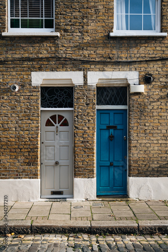 Colourful doors and brick facade in Portobello Street, London