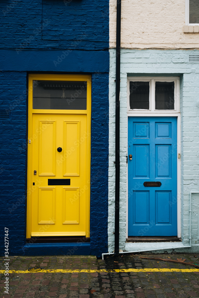 Colourful doors and brick facade in Portobello Street, London