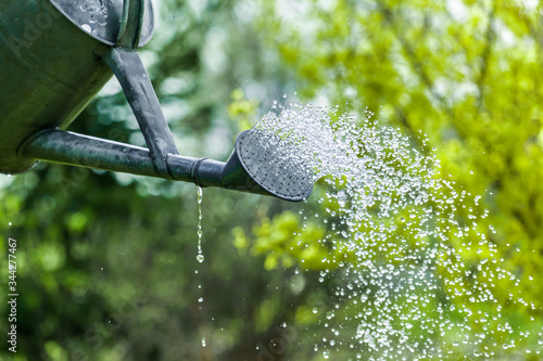 Spring summer garden watering. Water saving ecology gardening background