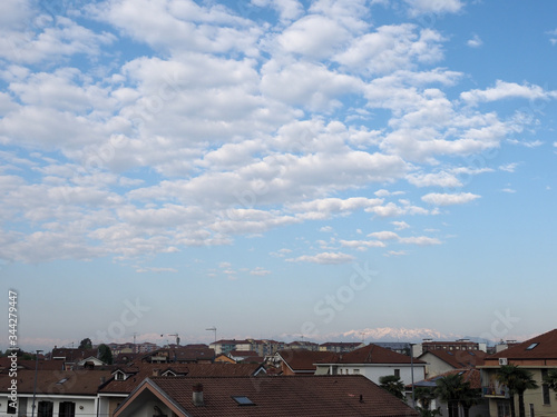 blue sky with clouds and urban skyline