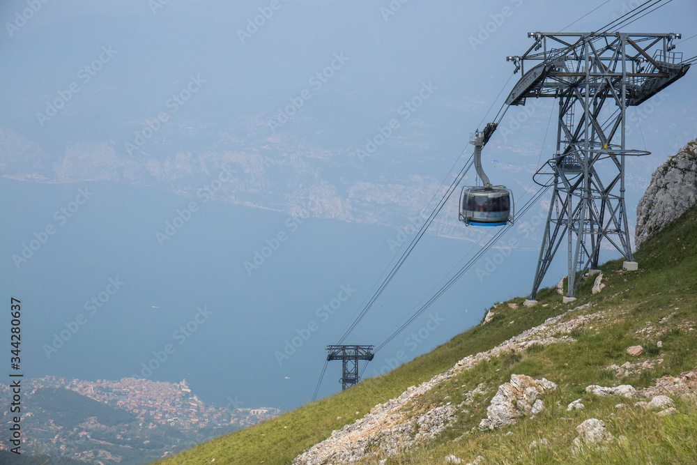 cable car going up to the top of a mountain