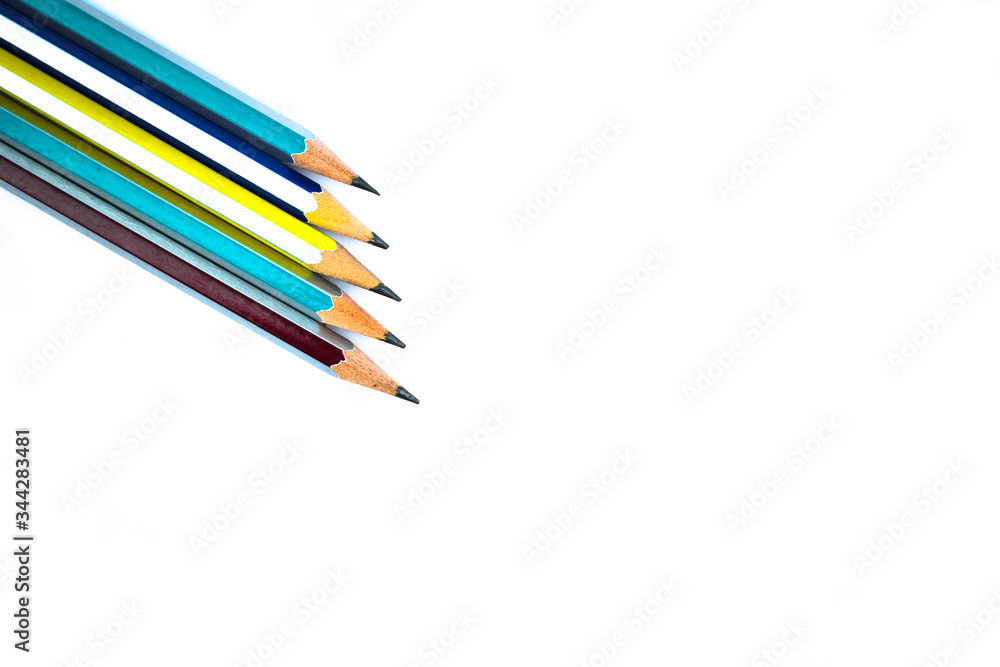 Five different colored wood pencil crayons arranged on a white background Five different colored wood pencil crayons arranged on a white background