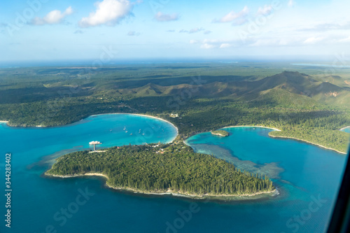 aerial view of isle of pines off the coast of new caledonia. Some boats on turquoise bay