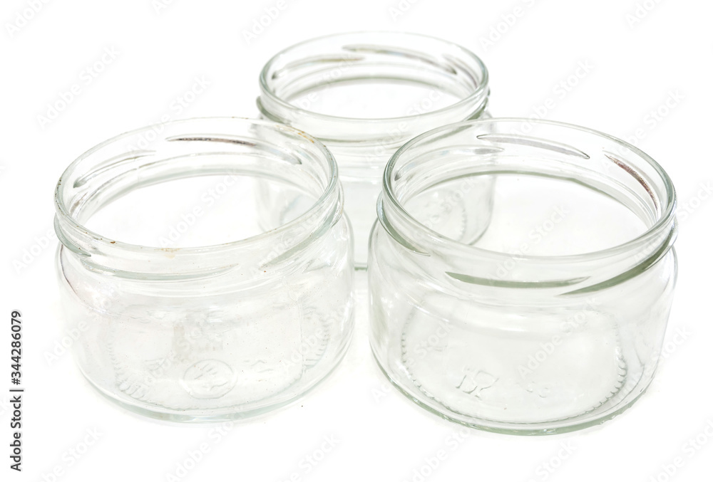 glass small jars isolated on white background. Close-up. glass small jars isolated on white background. Close-up.