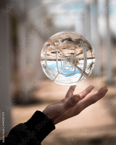 Crystal ball levitating over boy s hand