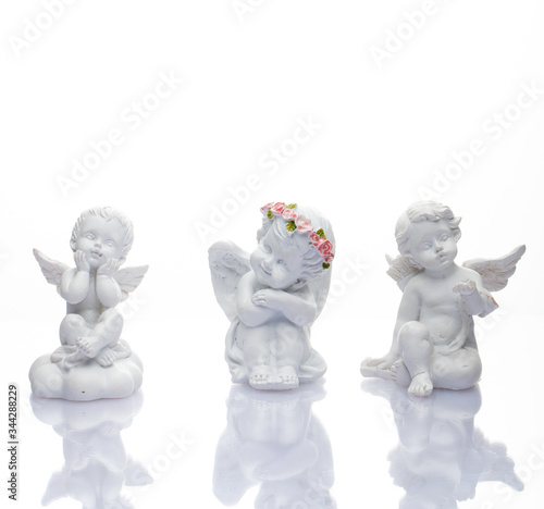 Guardian angel over white background. Christmas decoration. Angelic cupid statue 