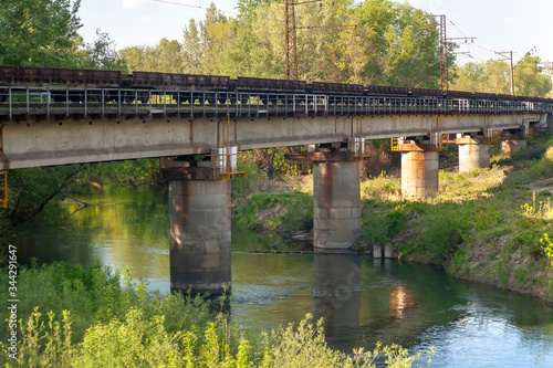 train rides across the bridge. Ukrainian railway