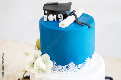 Graduation party. Cake table with sweets and decoration