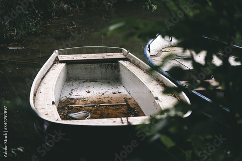 Obraz na plátně Small fishing boat on the lakeshore.