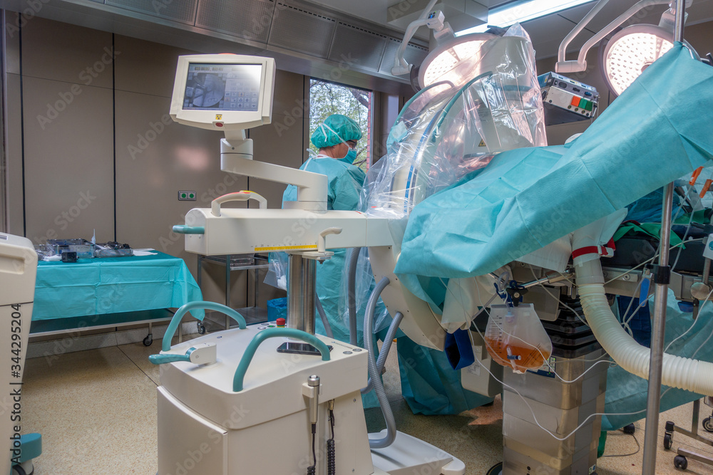 in an operating theatre, a hip prosthesis operation in an operating theatre, a hip prosthesis operation