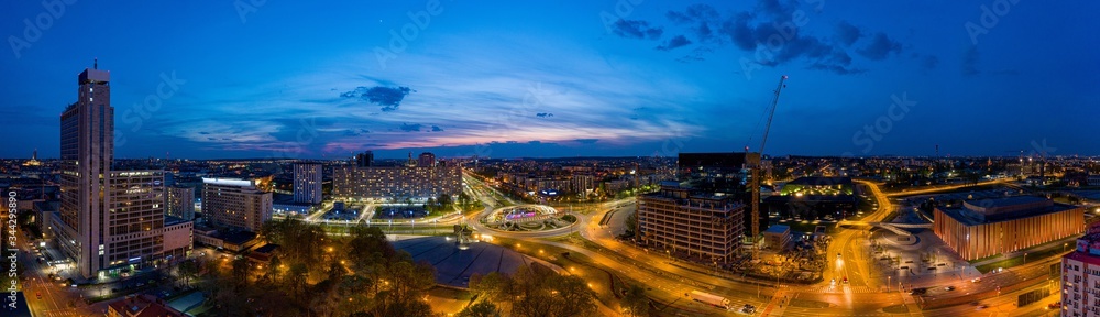 Panoramic aerial drone photo of city centre of Katowice at night.