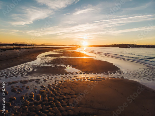 Aerial shot of Somo beach in northern spain famous for surfing at sunset
