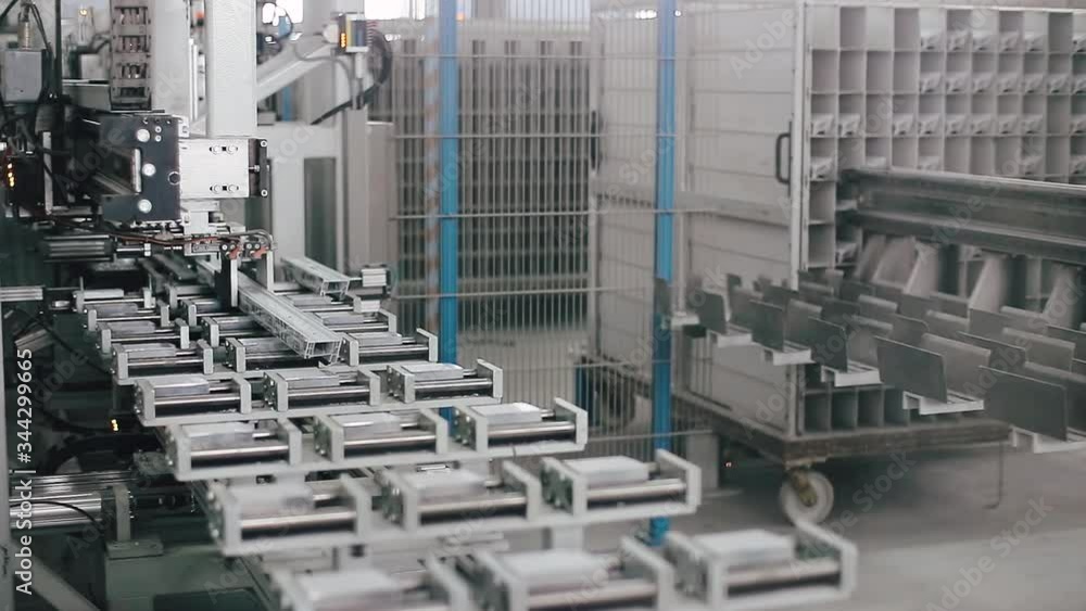 Automatic machine in Factory for UPVC windows and doors production. Manufacturing jobs. Factory Work on the production of PVC windows. UPVC window production technology. Automatic machine in Factory for UPVC windows and doors production. Manufacturing jobs. Factory Work on the production of PVC windows. UPVC window production technology.