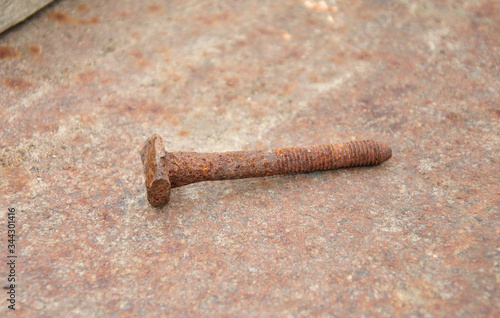  old rusty bolt on a rusty background