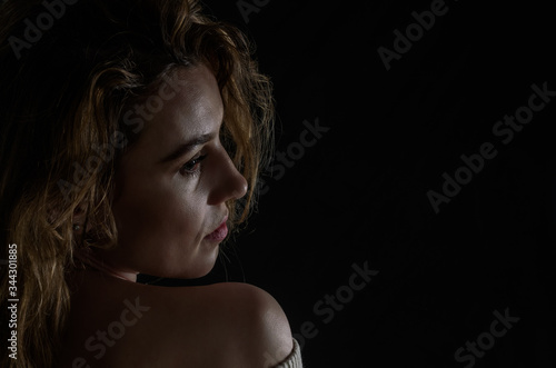 Silhouette portrait of a girl isolated on a dark background