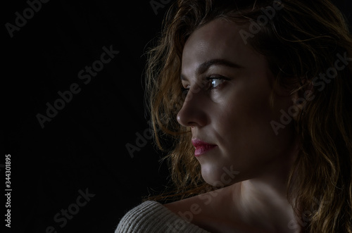 Silhouette portrait of a girl isolated on a dark background