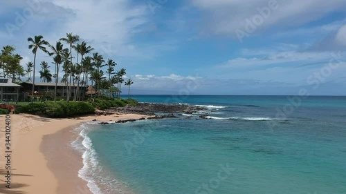 Aerial footage flying towards the rocky coast of napili point on Maui