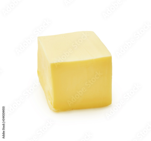 Piece of butter isolated on white background. Butter cube.