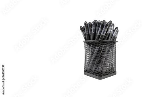 Close-up black pens in holder basket isolated white background without shadow with copy space