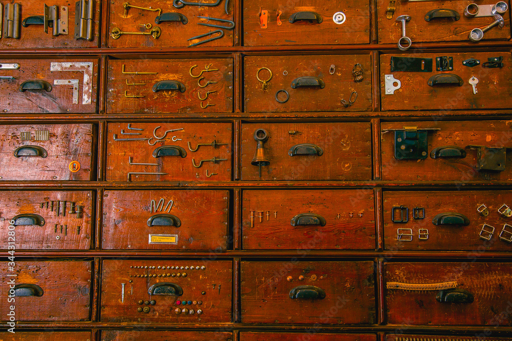 Old wooden wardrobe with small drawers for storing details, vintage retro-safe, exclusive 19th century handmade mini-wardrobe.