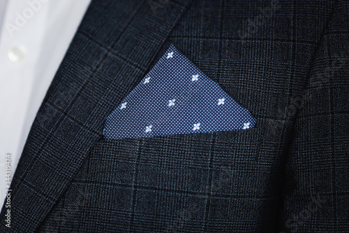 Close up of men's suit with pocket square. photo