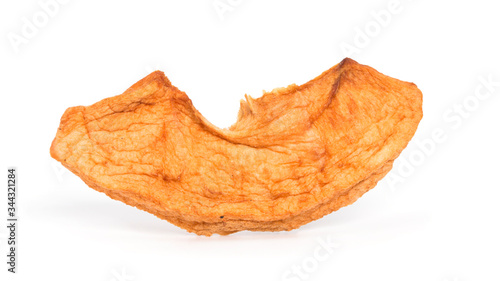 Dried apple chips isolated on white background