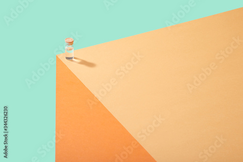 Corona Virus Covid 19 Vaccine Cure in Vial on Counter Table Top
Single vial lined up on edge of table surface  bright bold colors