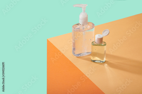 Corona Virus Covid 19 Vacine Cure Hand Sanitizers Cleansers Anti Bacterial Containers on Table Counter Top
Hand sanitizers on edge of table surface  bright bold colors