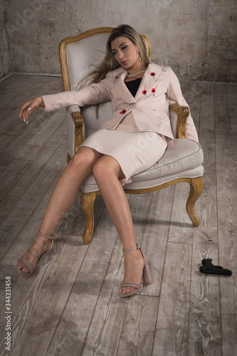 Crime scene (imitation). Pretty business woman shot in the chest.