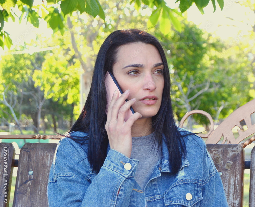 young woman talking on the phone young woman talking on the phone