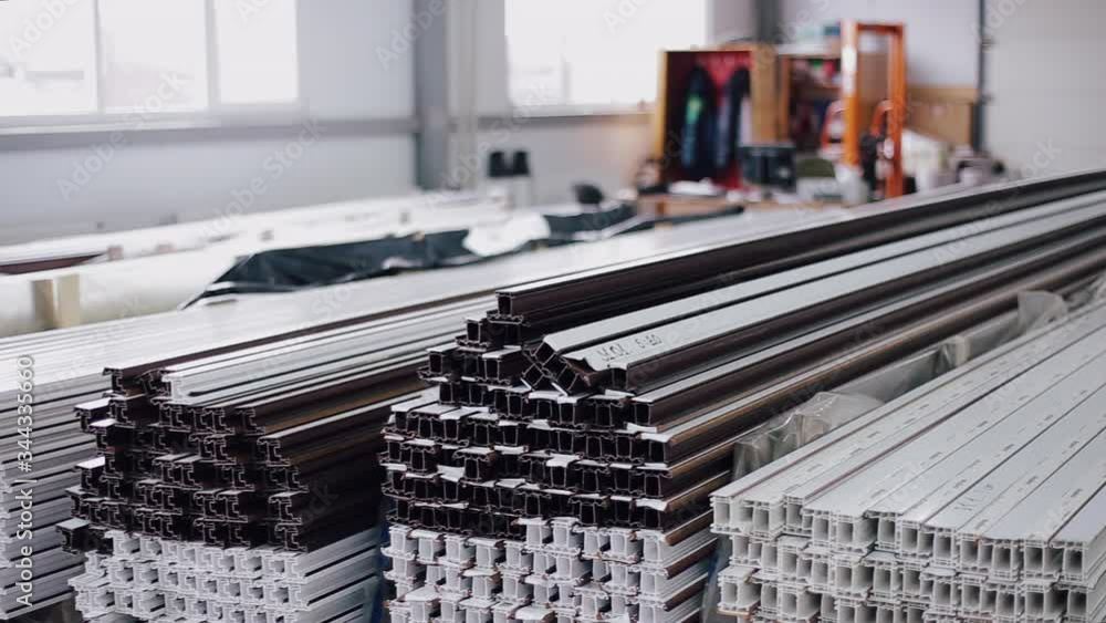 Shelf with profile blanks for the production of plastic windows ...