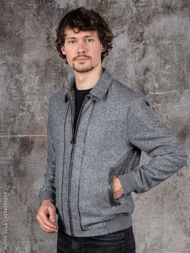 Studio portrait of attractive young man. Young Male Fashion Model Posing In Casual Outfit. Studio portrait of attractive young man. Young Male Fashion Model Posing In Casual Outfit.