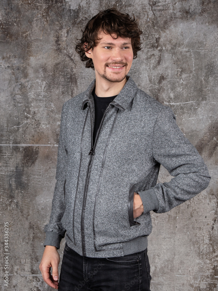 Studio portrait of attractive young man. Young Male Fashion Model Posing In Casual Outfit. Studio portrait of attractive young man. Young Male Fashion Model Posing In Casual Outfit.