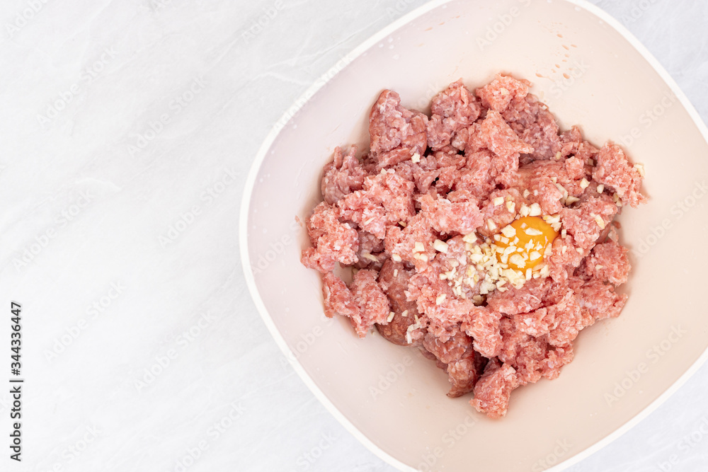 Raw minced meat with smashed eggs and chopped onion mixture for meatballs Raw minced meat with smashed eggs and chopped onion mixture for meatballs