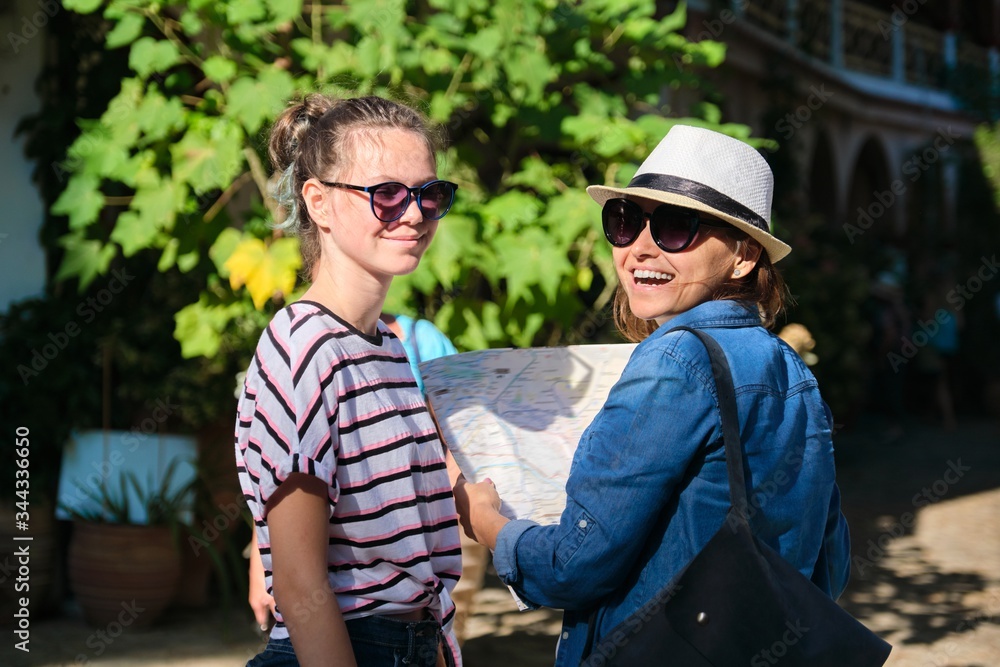 Tourism, women visiting the Christian monastery, historical monument in Greece in the mountains Tourism, women visiting the Christian monastery, historical monument in Greece in the mountains