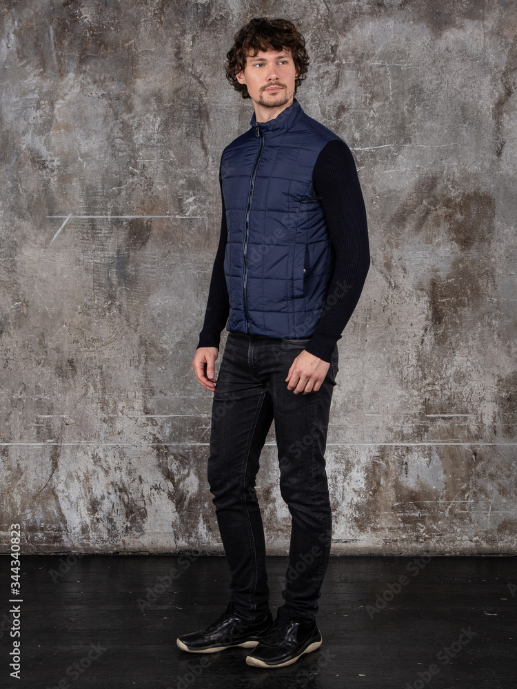 Full length studio portrait of attractive young man. Young Male Fashion Model Posing In Casual Outfit. 