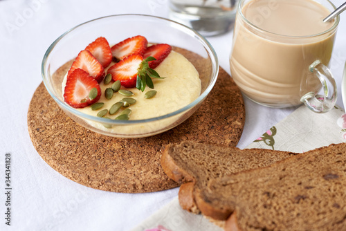 breakfast of cereal and fruit with coffee photo