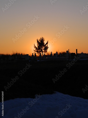 Sunlight encounters more air molecules when the sun is low in the sky than when the sun is overhead. Even more blue light is scattered away, leaving mostly the reddish component of white sunlight 