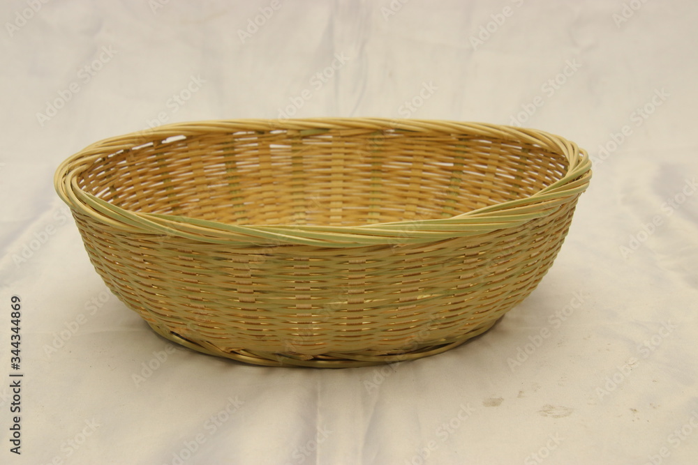 A woven wicker basket. Fruit Basket. Home table decoration A woven wicker basket. Fruit Basket. Home table decoration