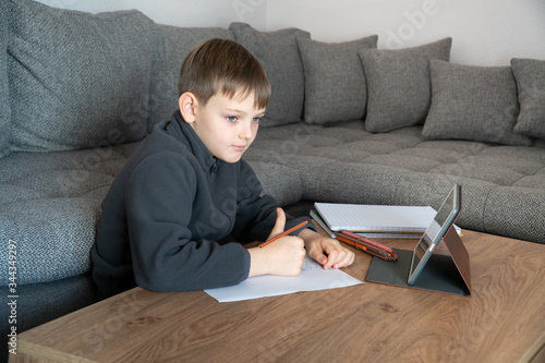 Distance learning online education. Child boy at Home distance education and learning.