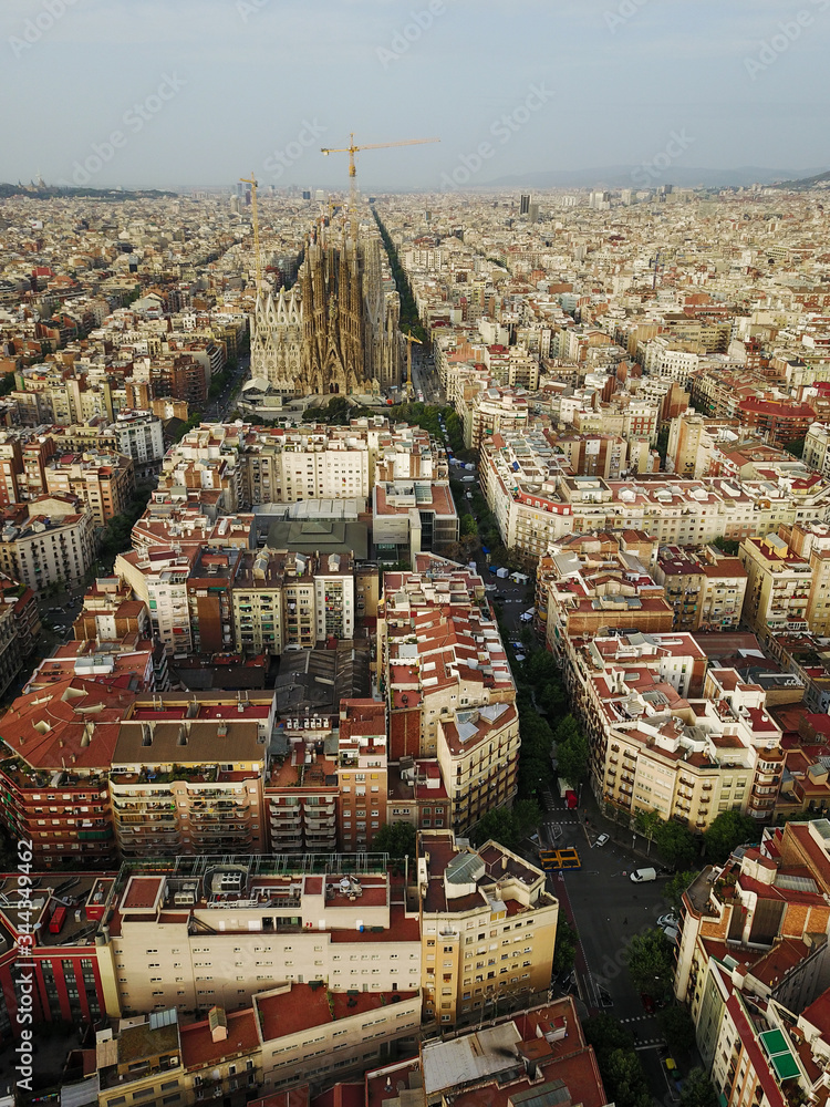 Fototapeta premium The house of Barcelona at sunset. Aerial photography