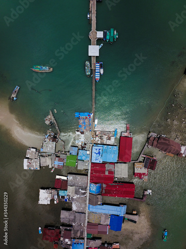 view of the pier with boats in Thailand on the island of Ko Chang 