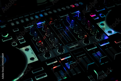 Blue light spots on DJ Controller in Club night all in one controller photo