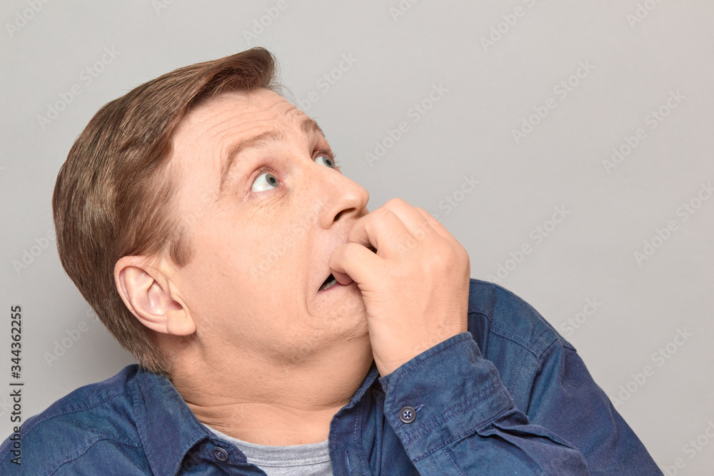 Portrait of shocked frightened man with eyes widened and full of fear Portrait of shocked frightened man with eyes widened and full of fear