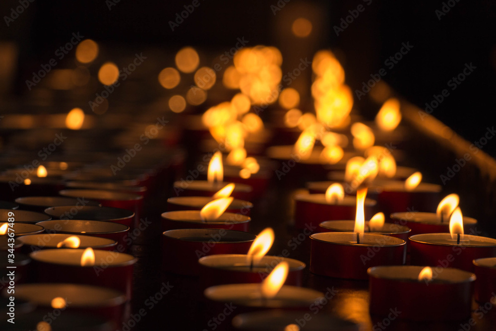 The view of lighted tealight candles. Burning candles. The view of lighted tealight candles. Burning candles.