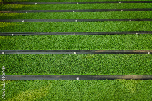 Stairs covered with green artificial grass