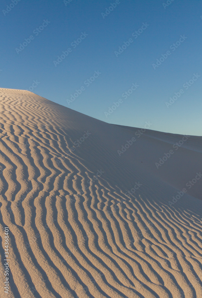 White sand dunes in Western Australia with blue sky White sand dunes in Western Australia with blue sky